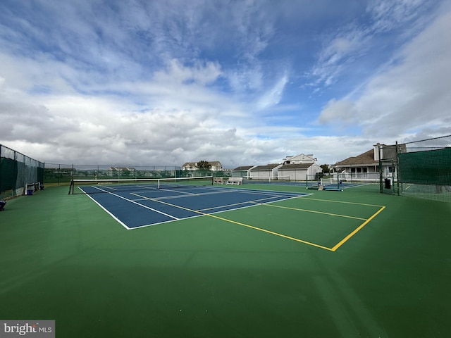 view of sport court with fence