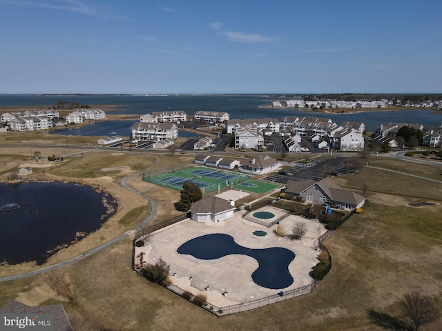 birds eye view of property featuring a residential view and a water view