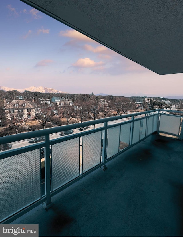 balcony at dusk with a mountain view