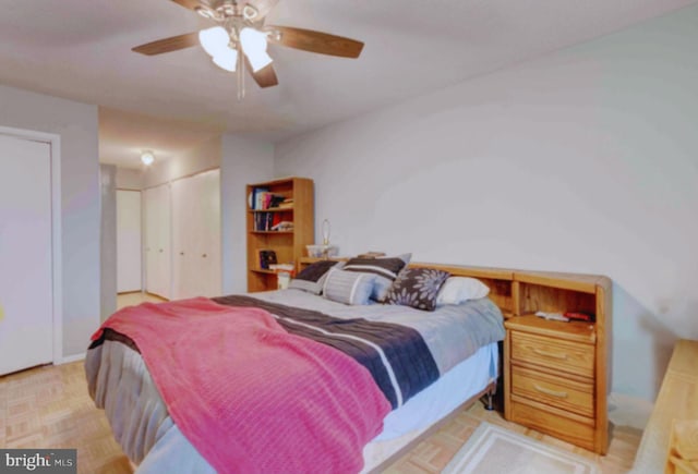 bedroom featuring two closets and a ceiling fan