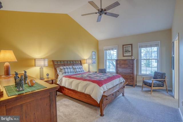 bedroom featuring baseboards, light colored carpet, ceiling fan, and high vaulted ceiling