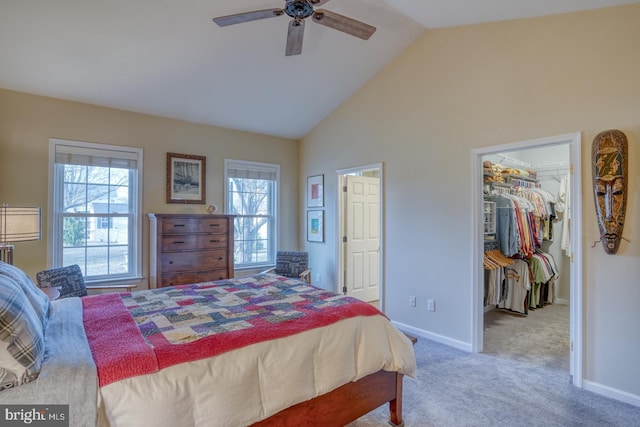 bedroom featuring carpet, baseboards, ceiling fan, a spacious closet, and a closet