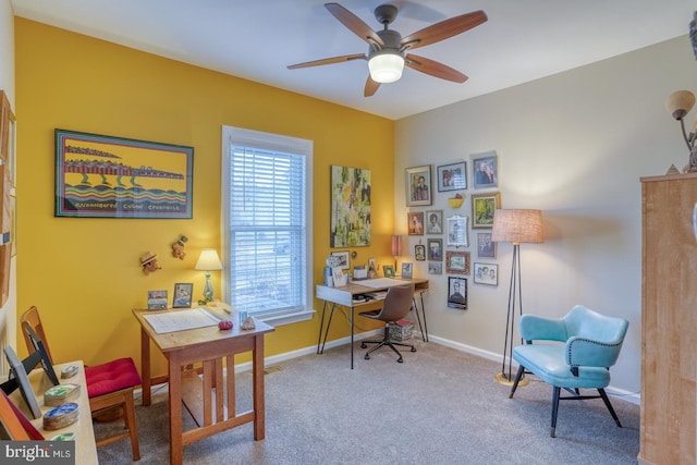 home office with baseboards, carpet, and a ceiling fan