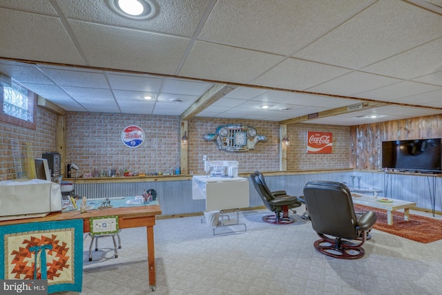 game room with recessed lighting, brick wall, a paneled ceiling, and carpet floors