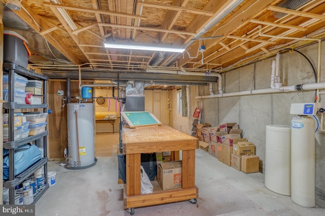 unfinished basement featuring gas water heater