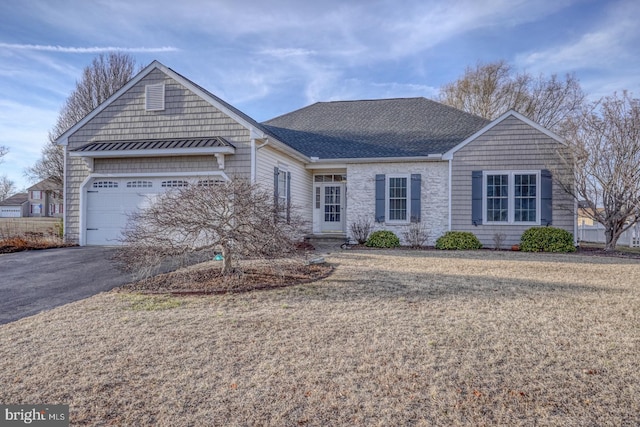 single story home featuring a front lawn, aphalt driveway, roof with shingles, stone siding, and an attached garage