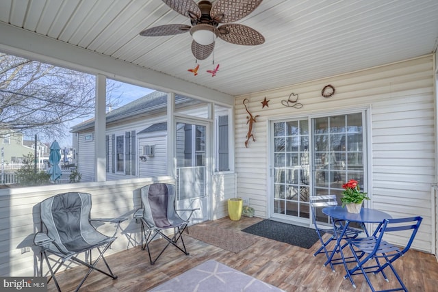 exterior space featuring a ceiling fan