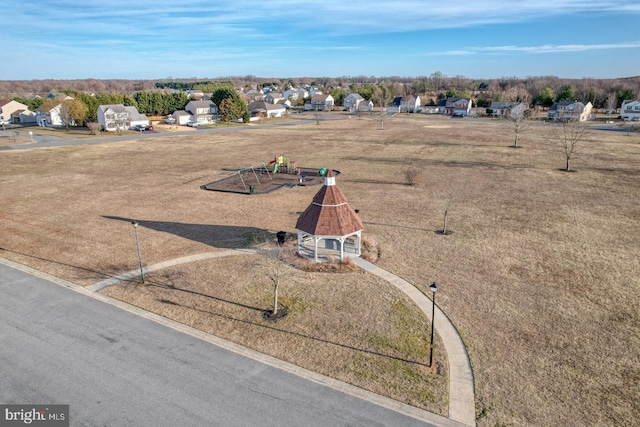 birds eye view of property with a residential view