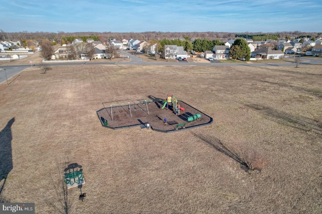 birds eye view of property with a residential view