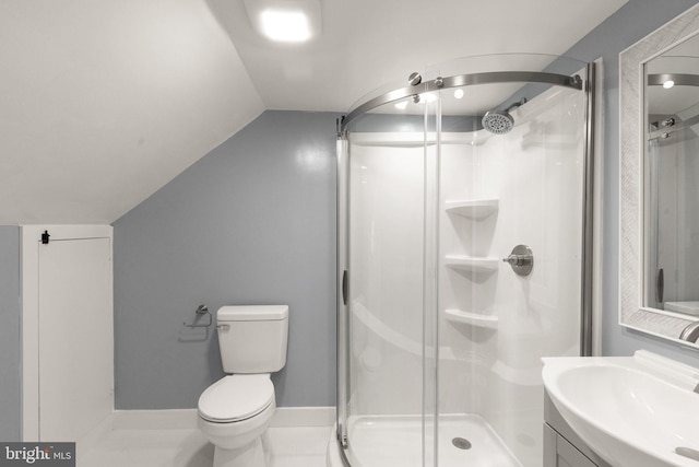 full bath featuring vanity, baseboards, lofted ceiling, a stall shower, and toilet