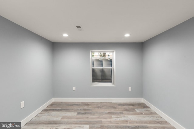 spare room featuring recessed lighting, visible vents, baseboards, and light wood finished floors