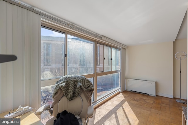 sunroom featuring radiator heating unit