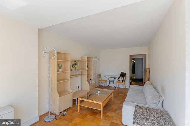 living room featuring baseboards