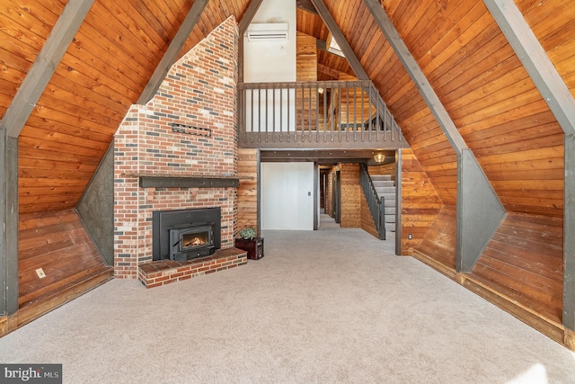 unfurnished living room with lofted ceiling with beams, carpet floors, wood ceiling, and wood walls