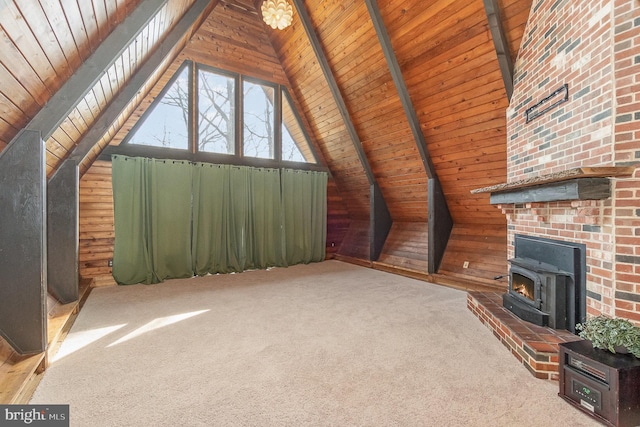 unfurnished living room featuring wooden ceiling, a wood stove, lofted ceiling with beams, and carpet floors