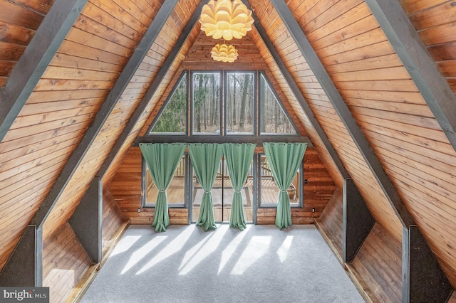 interior space featuring wooden ceiling and lofted ceiling with beams