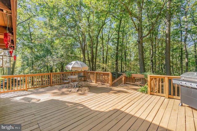 wooden deck with outdoor dining area