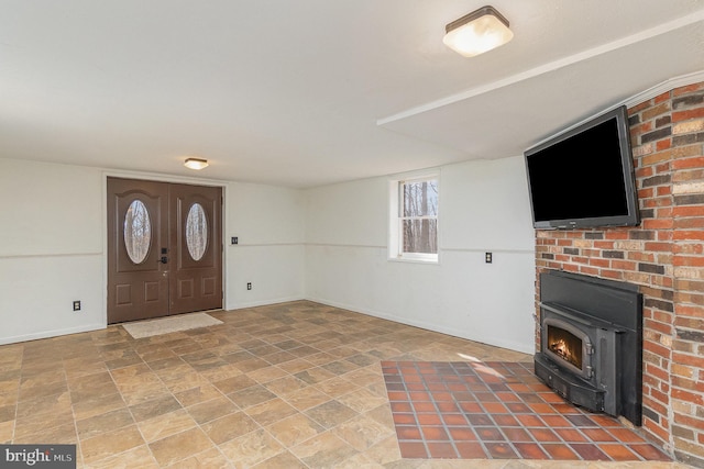 entryway featuring baseboards