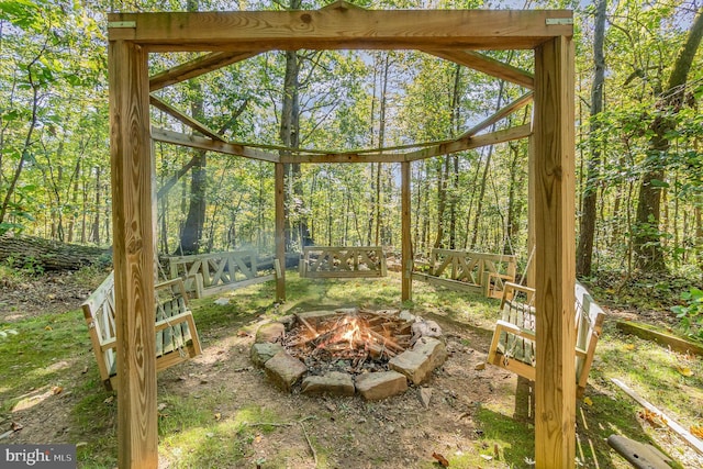 unfurnished sunroom with a forest view