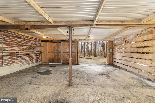 interior space featuring brick wall