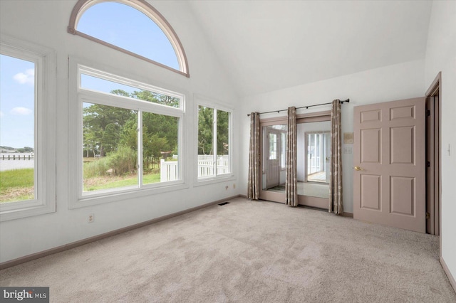 interior space with lofted ceiling and visible vents