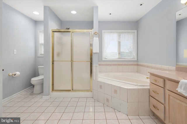 full bath featuring tile patterned flooring, toilet, a garden tub, a stall shower, and vanity