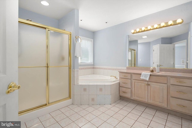 full bathroom featuring tile patterned flooring, a stall shower, vanity, and a garden tub