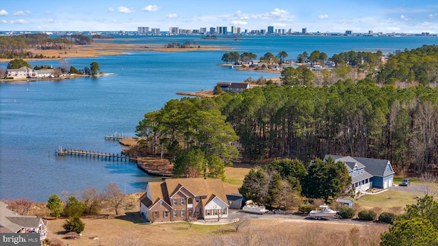 birds eye view of property with a city view and a water view