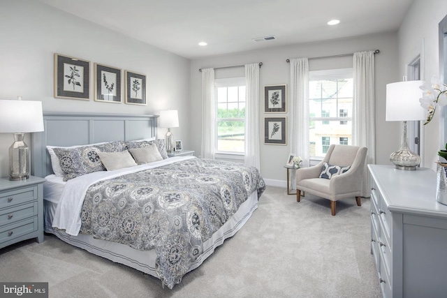 bedroom featuring recessed lighting, visible vents, light carpet, and baseboards