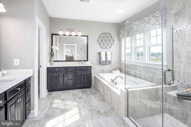 full bath with visible vents, a garden tub, a stall shower, and vanity