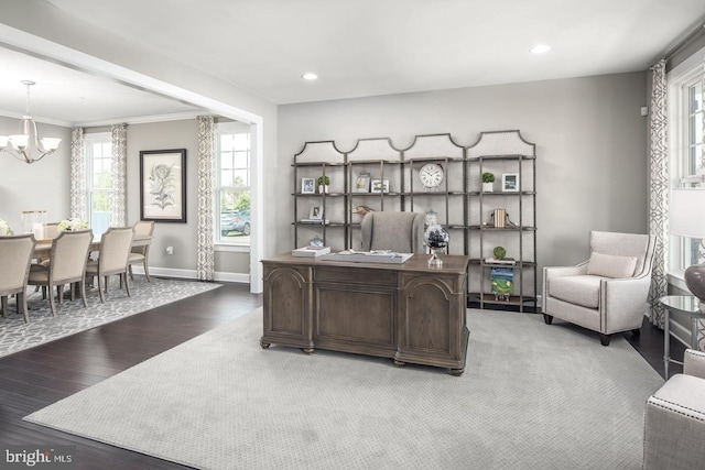 office space featuring wood finished floors, baseboards, an inviting chandelier, recessed lighting, and ornamental molding