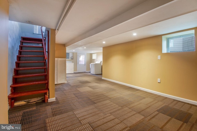 basement with recessed lighting, stairway, carpet flooring, baseboards, and washer / dryer