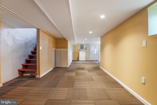 corridor featuring recessed lighting, baseboards, carpet, and stairs