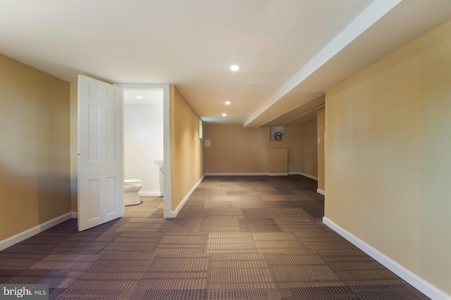 corridor with carpet flooring, recessed lighting, and baseboards