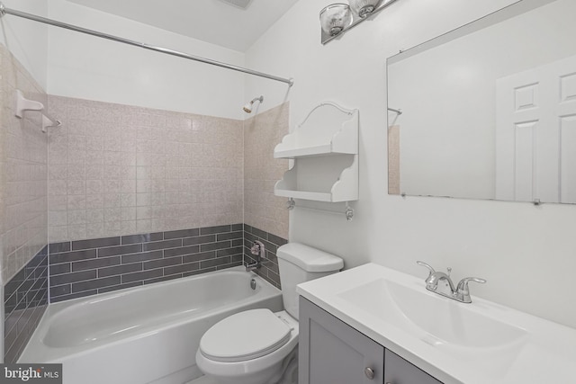 bathroom featuring visible vents, vanity, toilet, and shower / tub combination