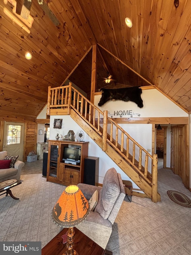 living area with lofted ceiling, stairway, wood ceiling, and carpet floors