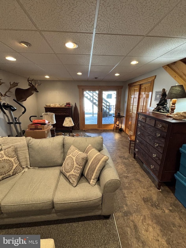 living area featuring recessed lighting and a paneled ceiling