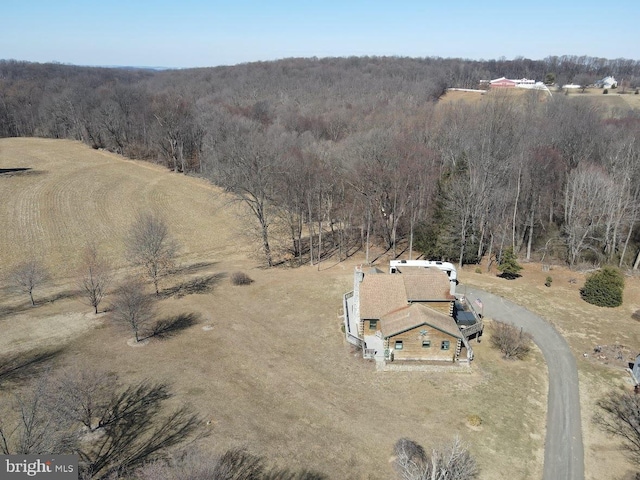 bird's eye view featuring a view of trees