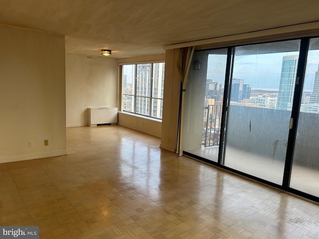 unfurnished room featuring baseboards