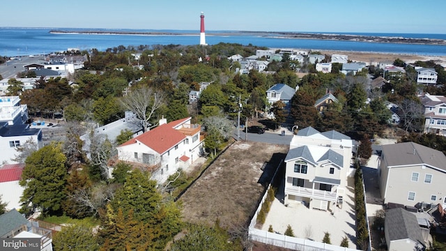 bird's eye view featuring a residential view and a water view