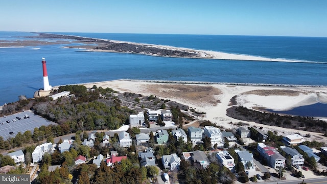 bird's eye view with a view of the beach and a water view