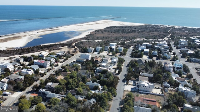 birds eye view of property featuring a view of the beach and a water view