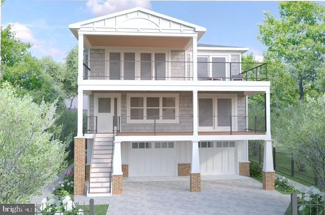 view of front of house with driveway, board and batten siding, a garage, a balcony, and stairs