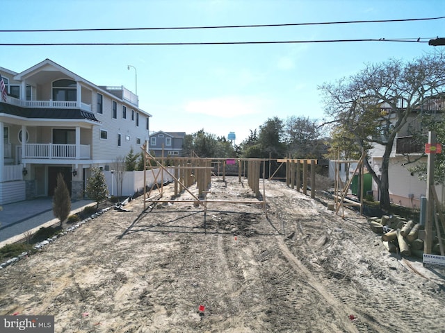 view of yard featuring a playground and fence