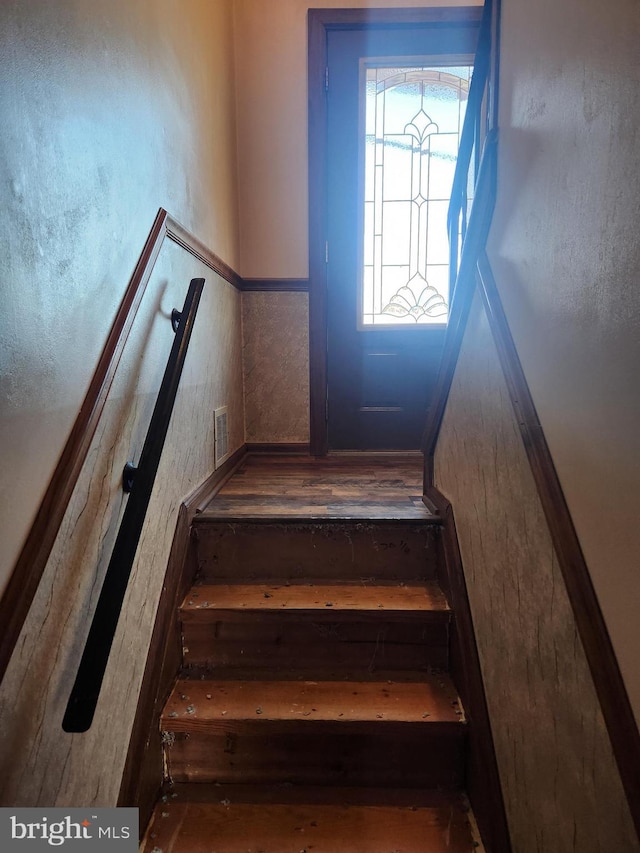 staircase featuring visible vents