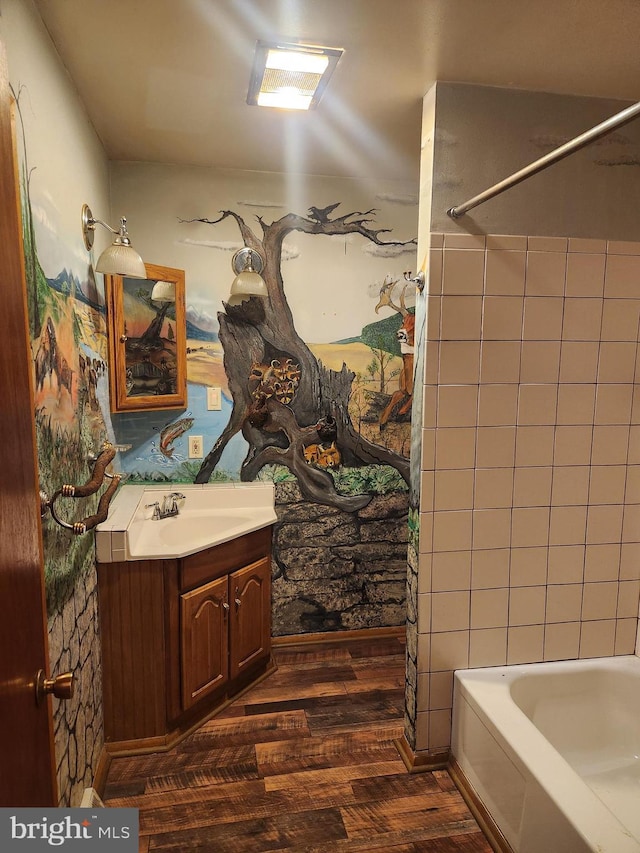 bathroom featuring visible vents, wood finished floors, and vanity