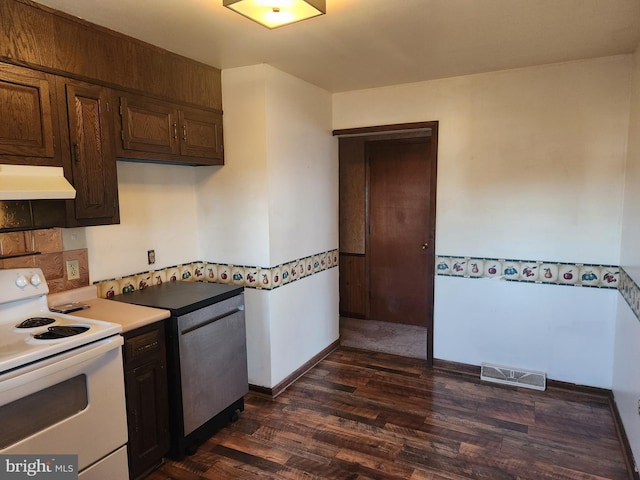 kitchen featuring visible vents, dark wood-type flooring, white electric range oven, exhaust hood, and light countertops