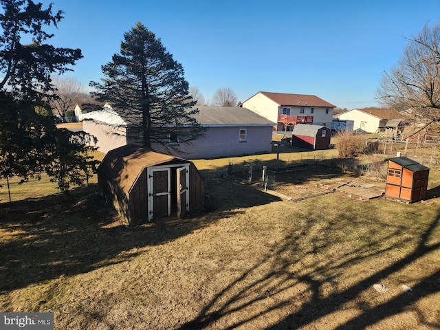 view of yard with an outbuilding and a shed