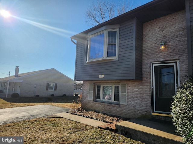 exterior space with brick siding