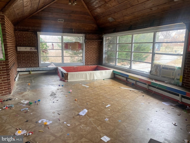 unfurnished sunroom featuring cooling unit, wood ceiling, and vaulted ceiling